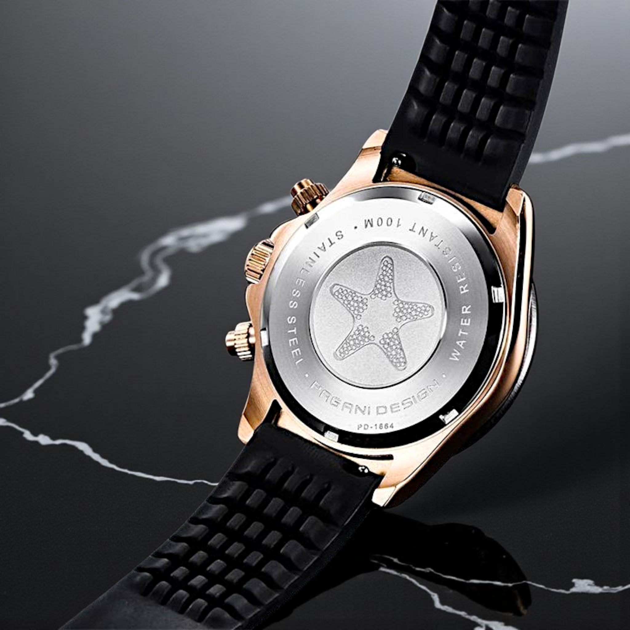 Luxury watch with black strap and rose gold case on a dark background