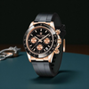 Luxury watch with black strap and rose gold accents on a dark background