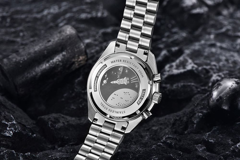Silver wristwatch with detailed face on a dark textured background